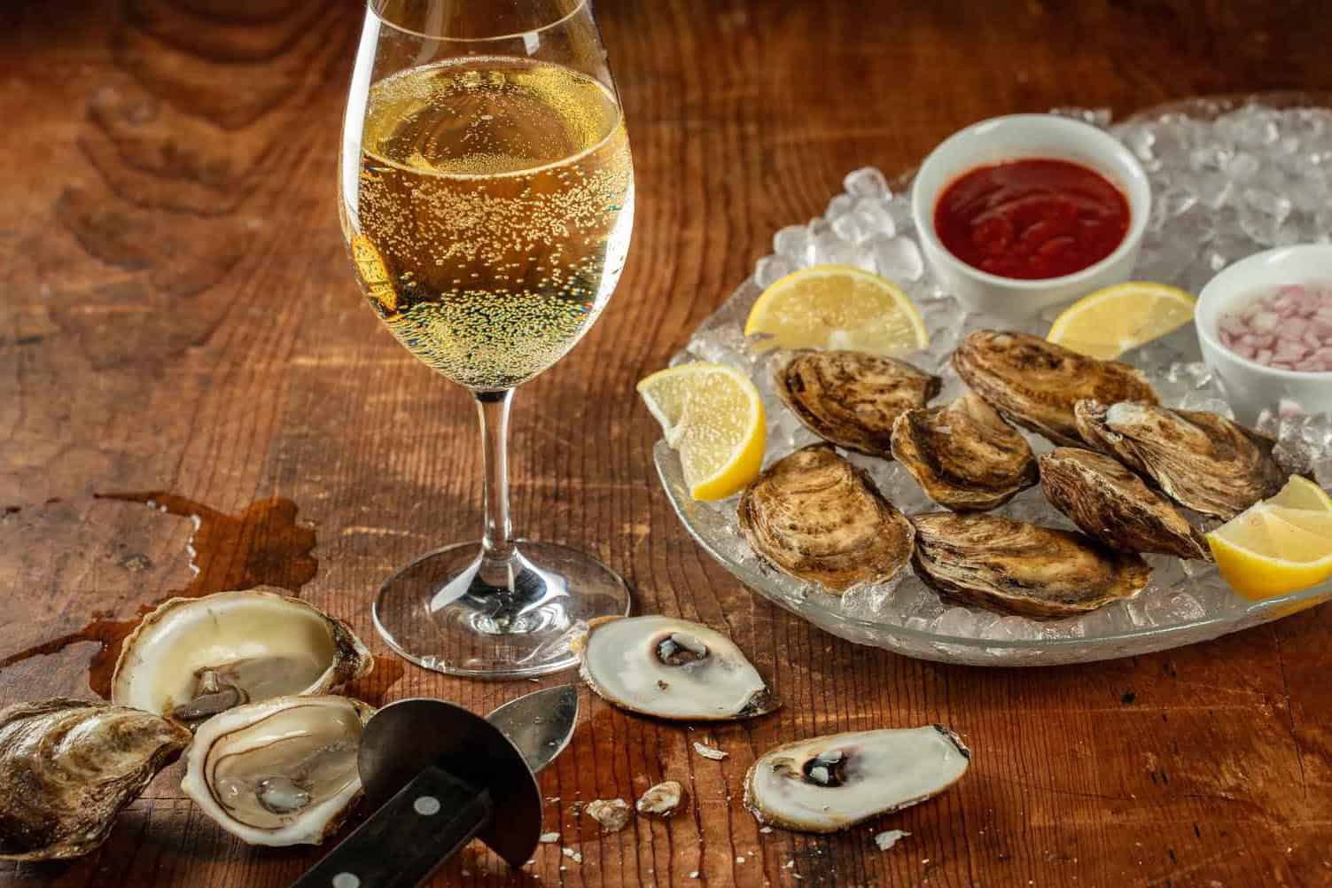 Sparkling wine or dry white wine and oysters