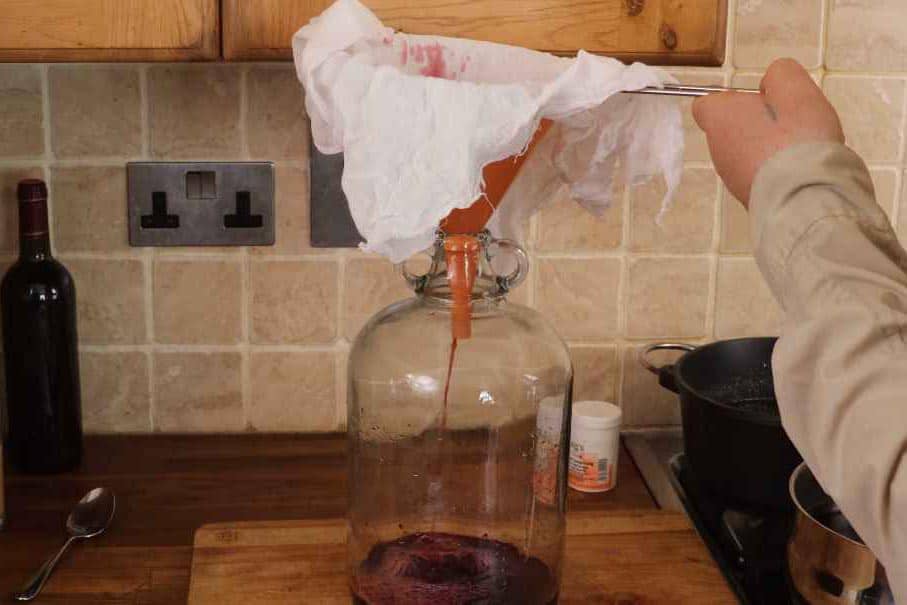 Step 7. Strain the Wine into a Bottle